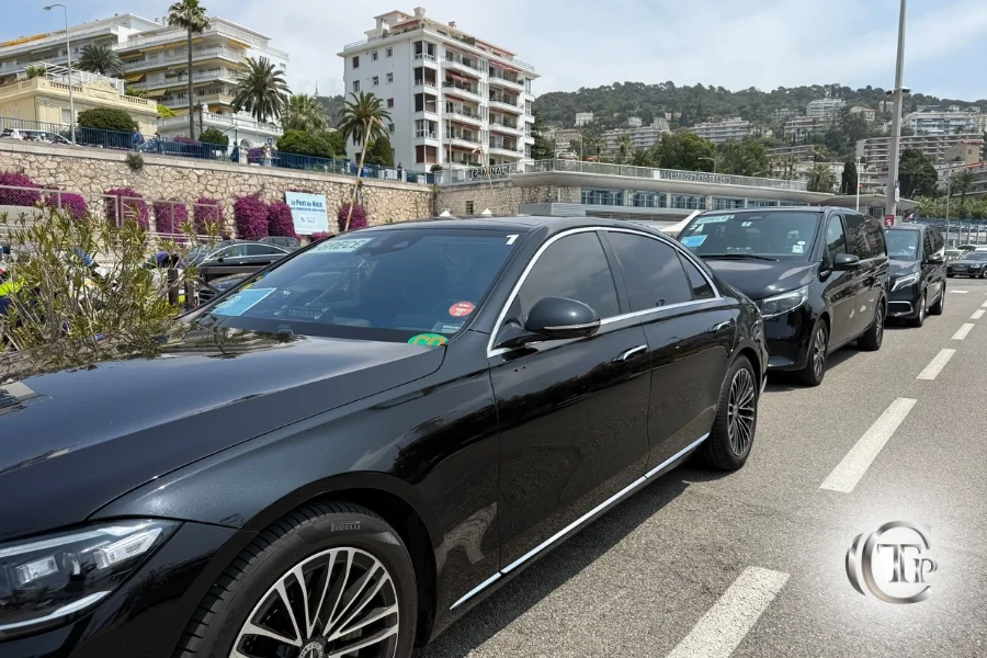 Black S-Class Mercedes with delegation badge followed by V-Class vans during the Ocean Conference in Nice.