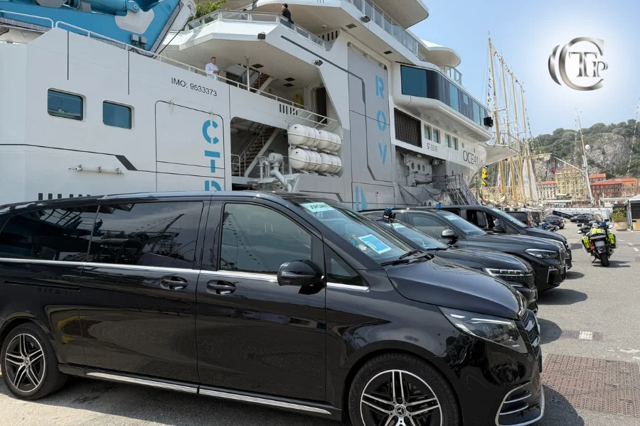 A row of CTP Mercedes vans lined up at the harbor in front of the OCEAN ship in Nice during the summit.