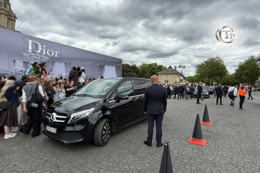 Mercedes V-Class and security at Dior Paris Fashion Week entrance.